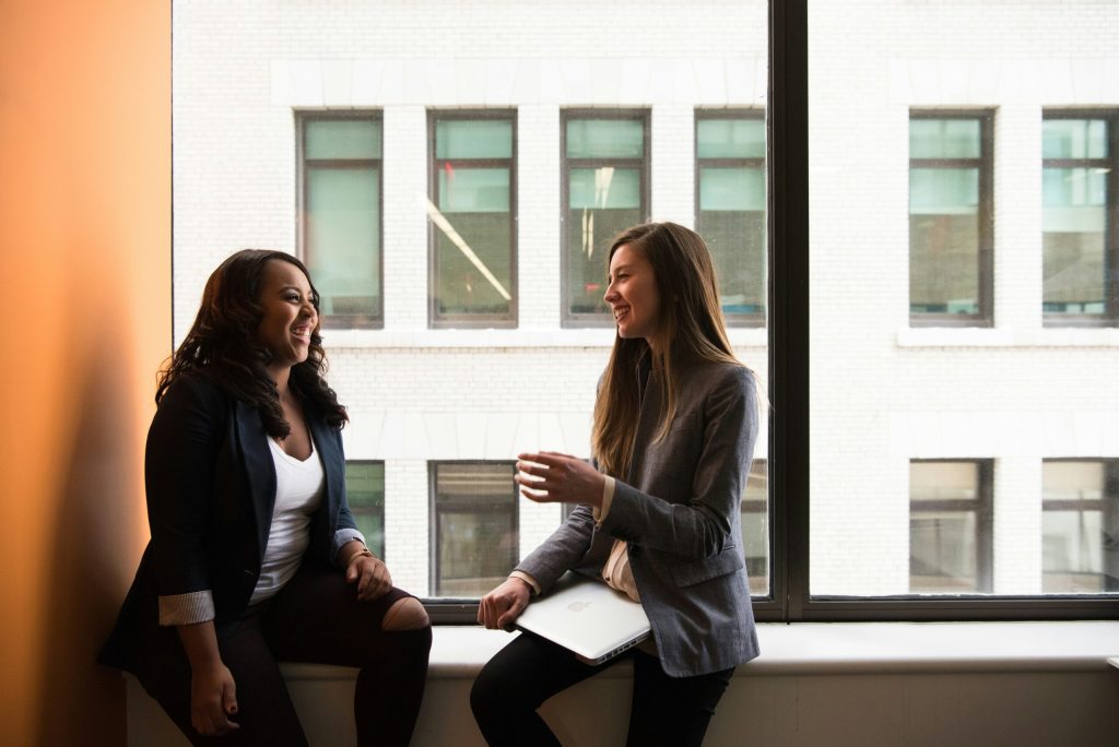 two professionals discussing limited company accounting in an office environment